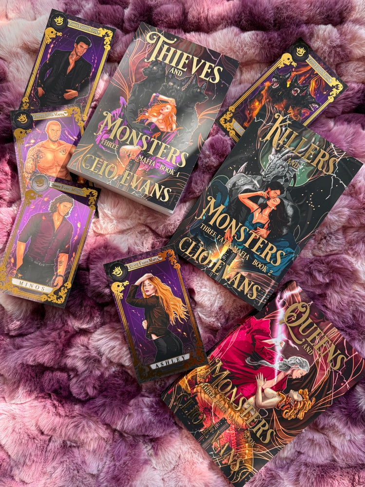 Collection of monster mafia book covers on a pink textured surface